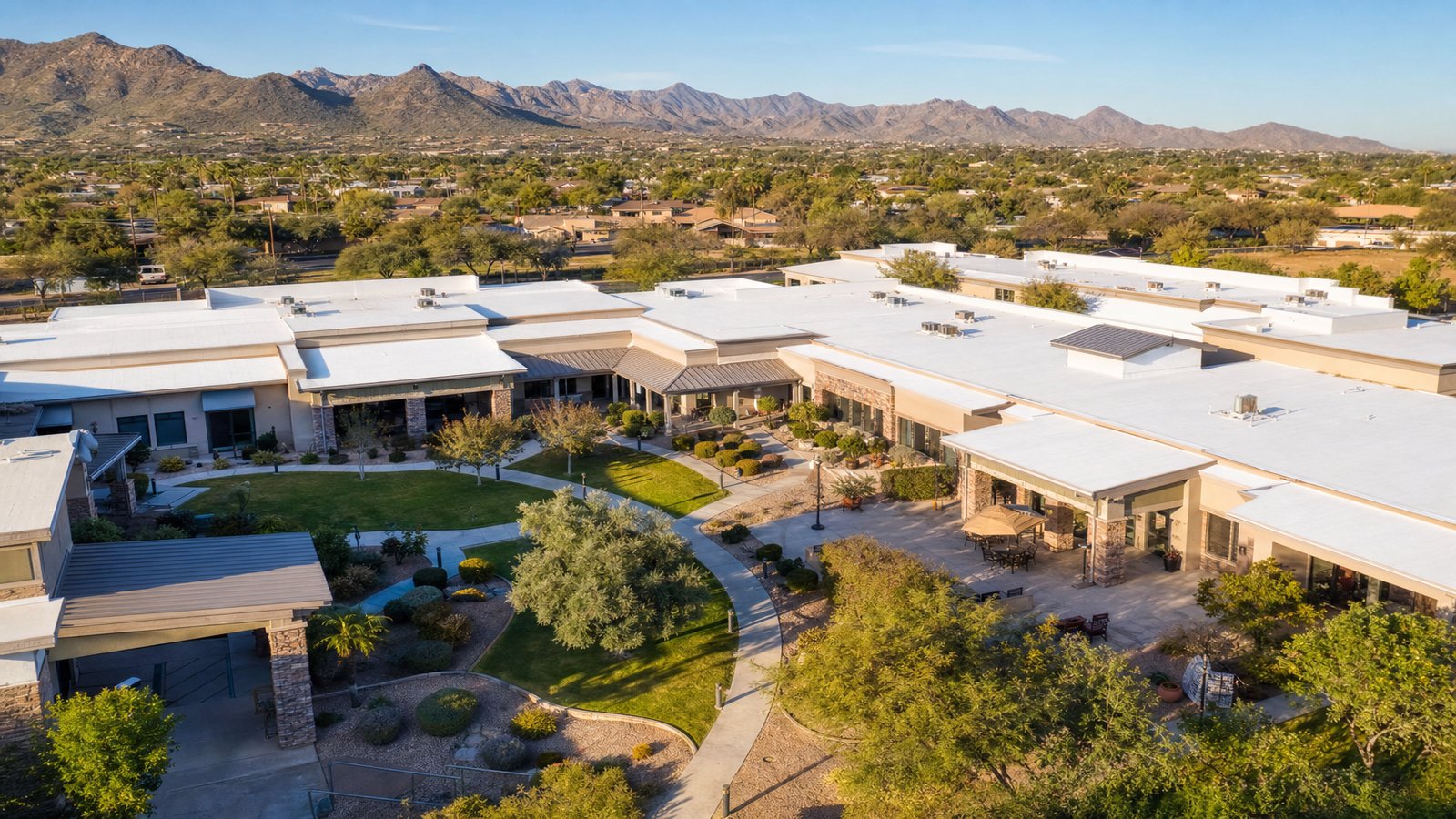 Aerial view of a Phoenix-area senior living community with restored white silicone roof