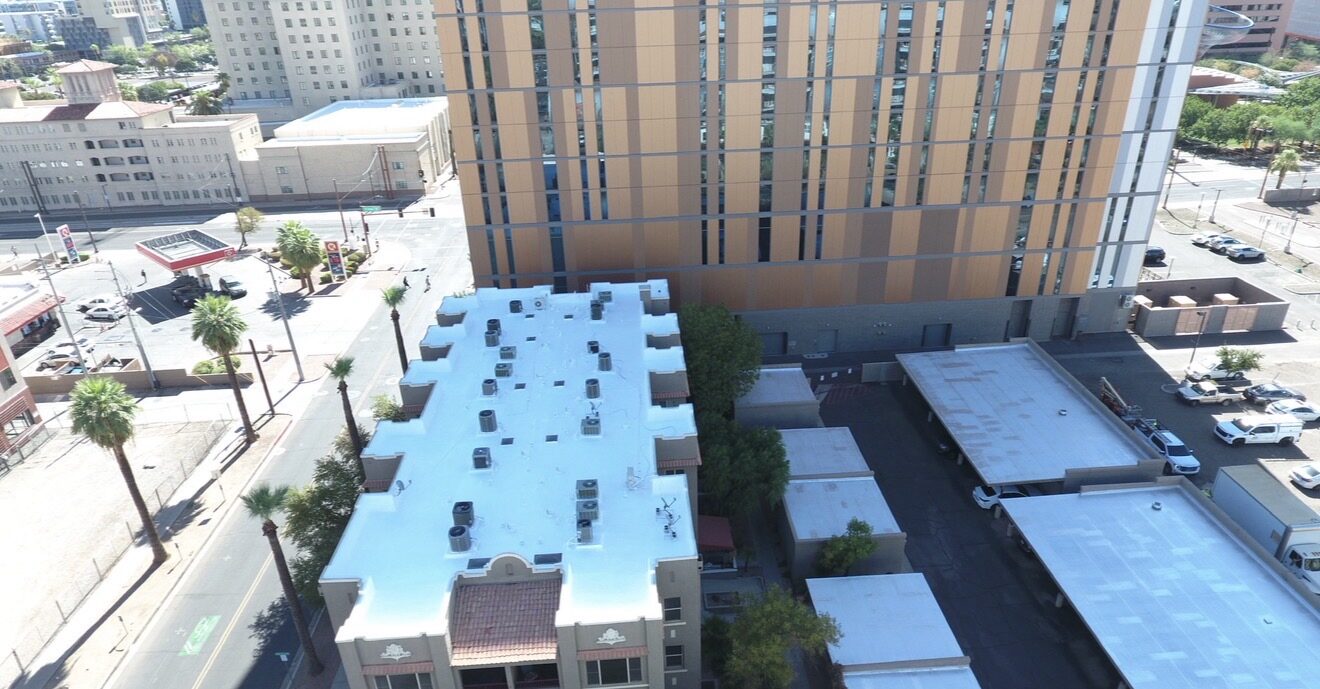 Aerial view of the finished Lofts on Fillmore HOA condo roof restoration at 387 N. 2nd Ave in downtown Phoenix Arizona with high-rise towers in the background